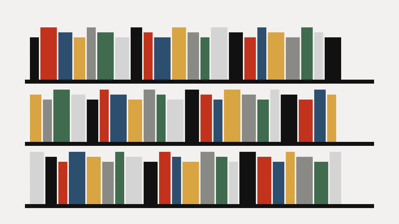 Three long shelves full of colourful books