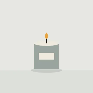 Lit candle in a grey concrete pot