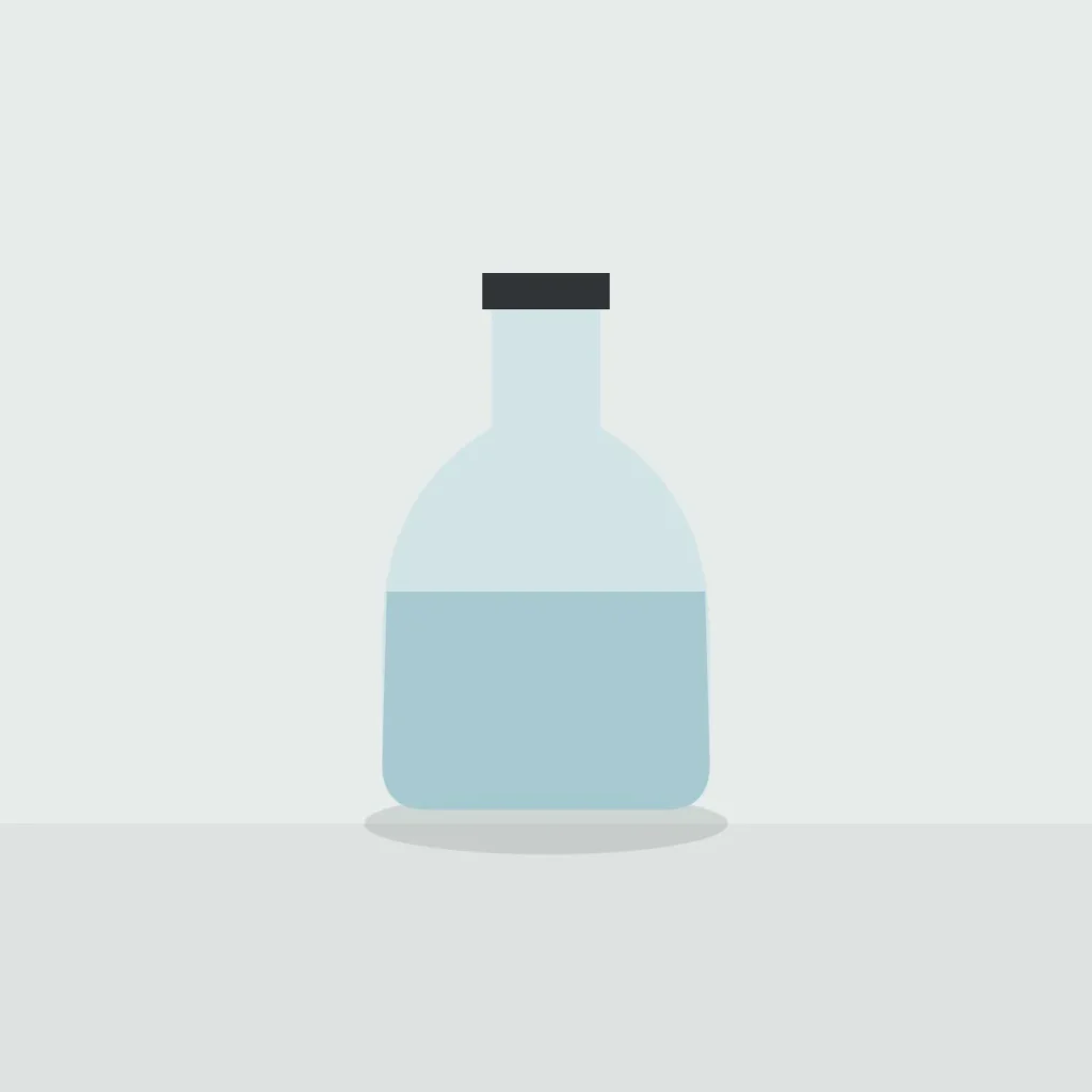 Clear glass carafe half filled with water