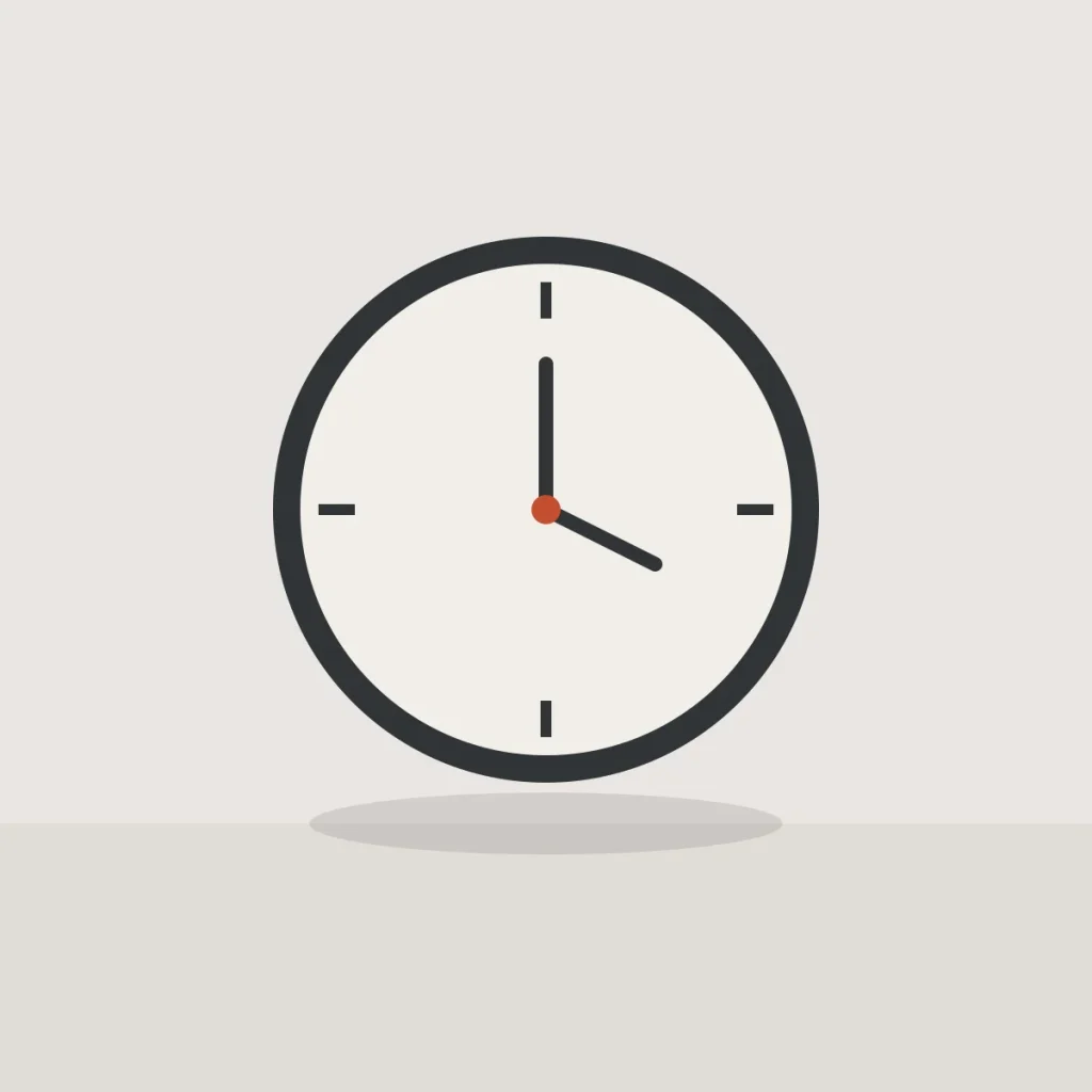 Round wall clock with a dark frame and a red centre