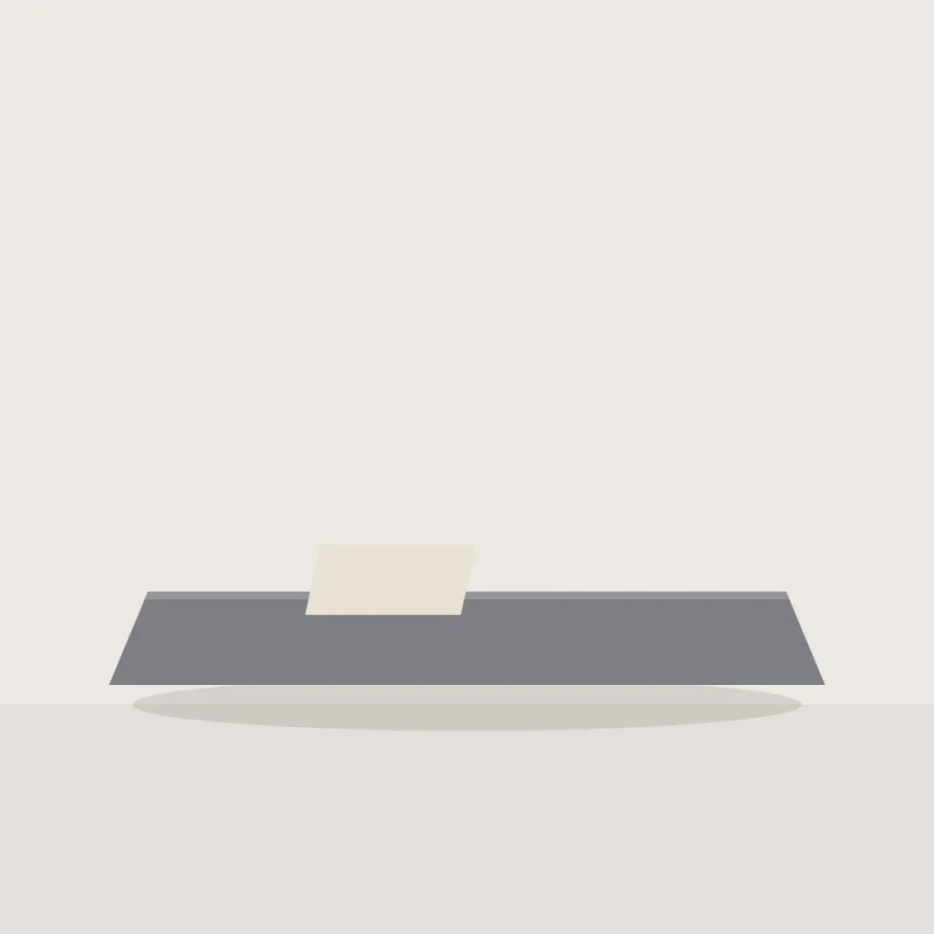 Grey felt desk mat with a sheet of paper on it