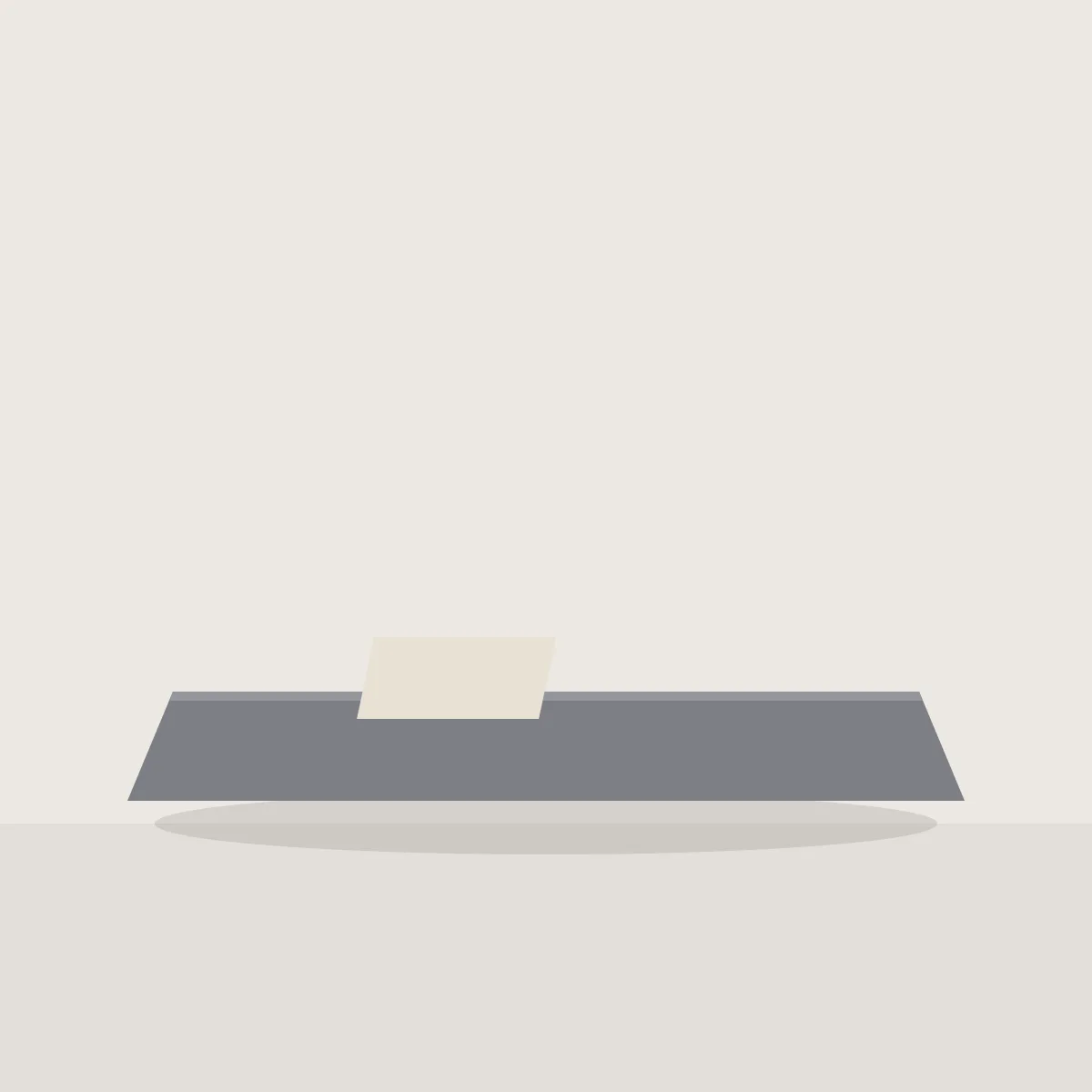 Grey felt desk mat with a sheet of paper on it