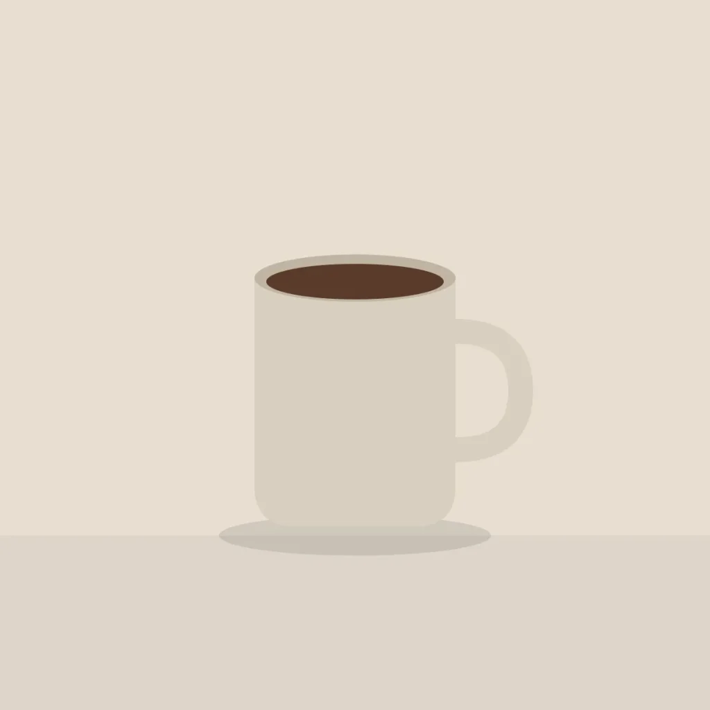 Sand coloured stoneware mug filled with coffee