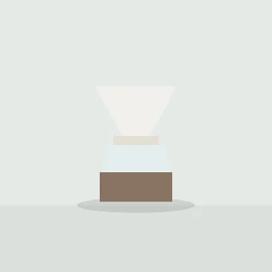 White porcelain dripper on a glass coffee server