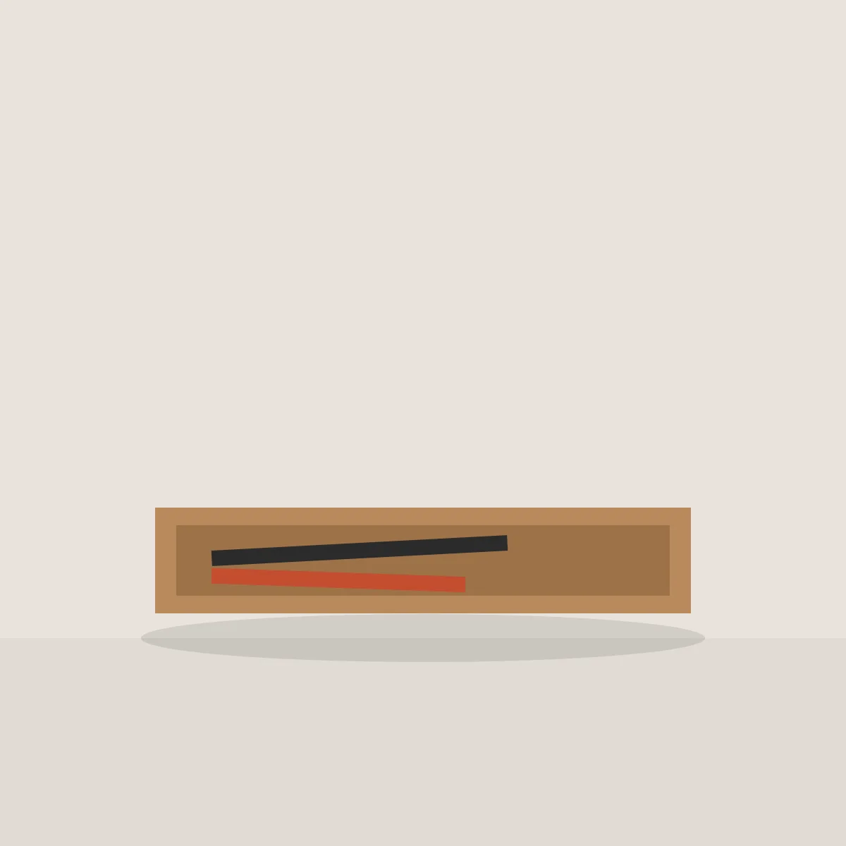 Low oak tray holding a black and a red pen
